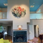 Installation in private home A mixed media art sculpture hanging over a fireplace