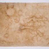 A sheet of tan handmade paper