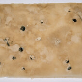 Detritus embedded in handmade paper