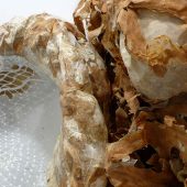 A mixed media art sculpture made from collagraph printed paper, Mylar and acrylic