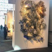 A large mixed media art sculpture in an art gallery