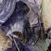 An art sculpture made from purple face masks