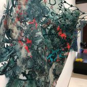 The side view of a mixed media art sculpture