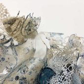 Pieces of handmade paper, fabric and lace