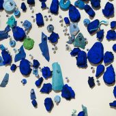 Detail,: cast paper, plastic detritus, glass pins