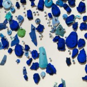 Detail,:  cast paper, plastic detritus, glass pins