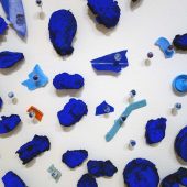 Detail,: cast paper, plastic detritus, glass pins