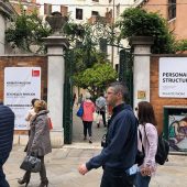 People walking by an art gallery