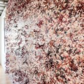 A wall in an art gallery covered with 3D paper art