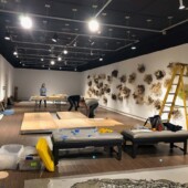 Installing the floor for Hello Sailor People setting up an art exhibit of mixed media art