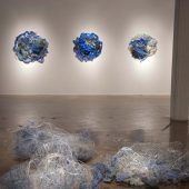 Mixed media art sculptures on the wall and floor