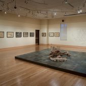 A large mixed media art sculpture in a gallery