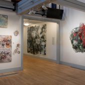 An art exhibit featuring mixed media art sculptures