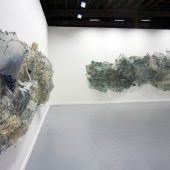 Two art sculptures made from paper, mylar and netting