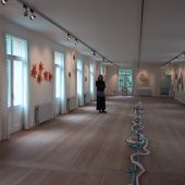 A woman standing in an art gallery