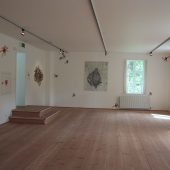 An art exhibit featuring mixed media art