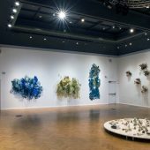 3D mixed media art sculptures on a gallery wall