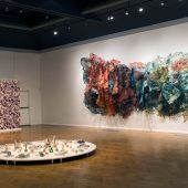 An art display of 3 mixed media art pieces