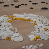 An art exhibit of small sculptures made from paper